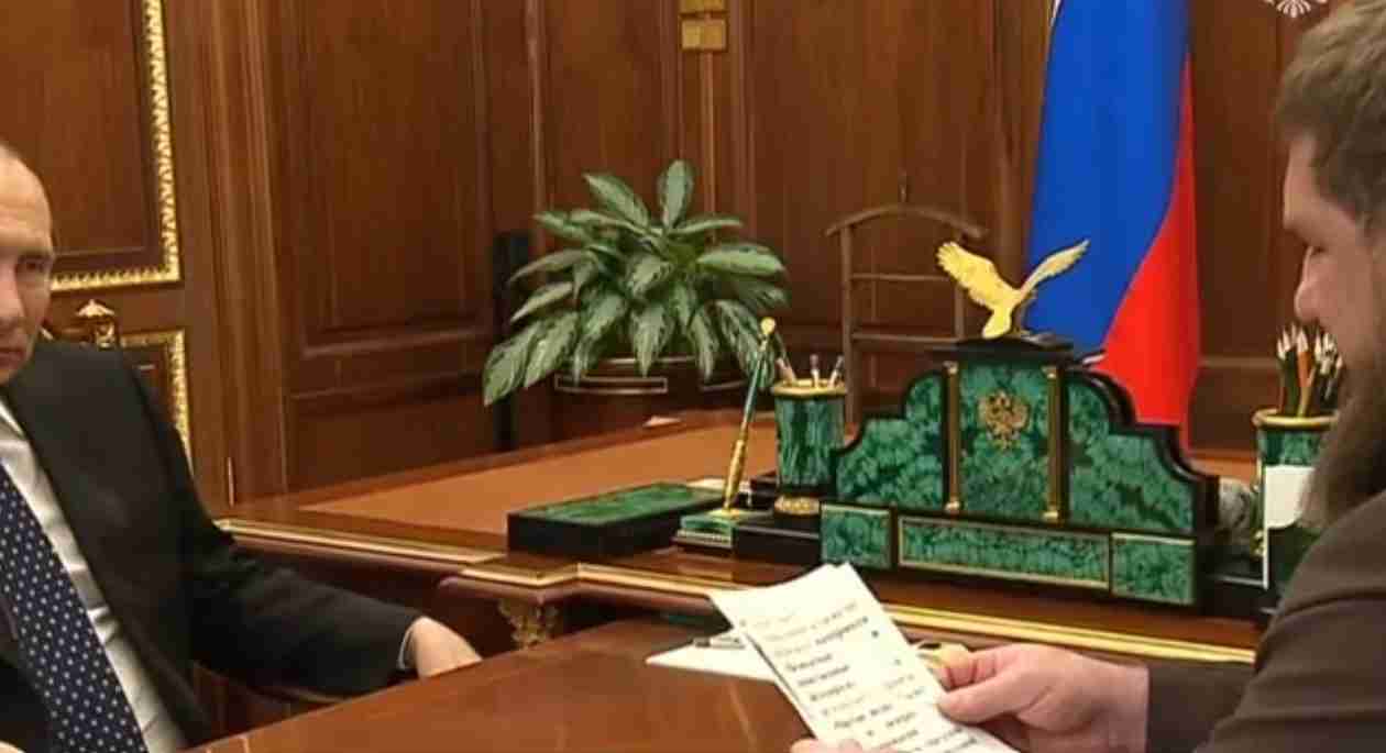 Putin Ally Kadyrov Hands Shaking Holding Piece Of Paper With Putin